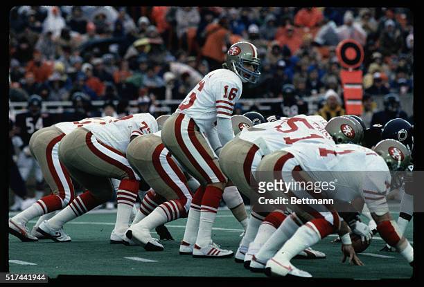 San Francisco 49ers' quarterback Joe Montana is shown on the line of scrimmage with his teammates in this photo taken during a game versus the...