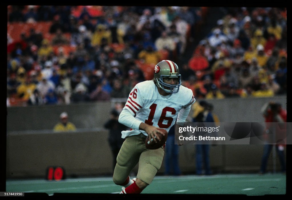 Joe Montana Runs With Football During Game