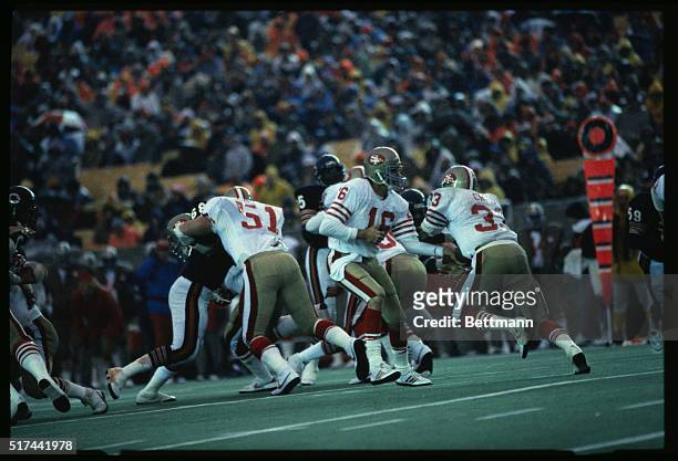 Photo shows football action during a game between the Chicago Bears and the San Francisco 49ers.