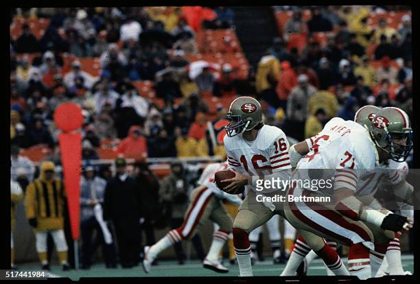 San Francisco 49ers' quarterback Joe Montana is shown running with the ball during a play in a game against the Chicago Bears 11/27.