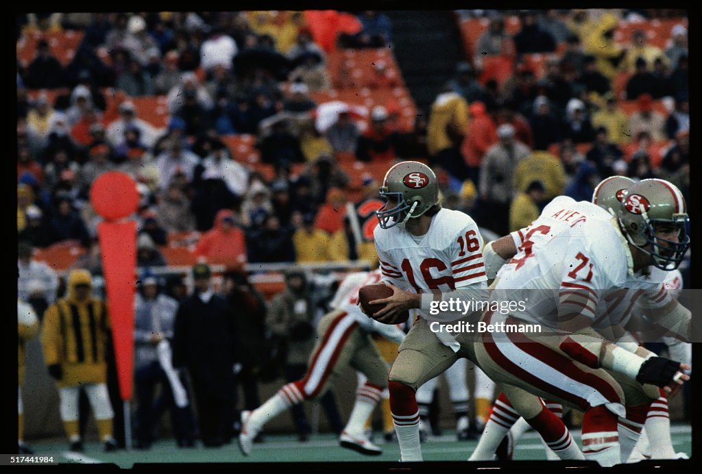 Joe Montana Runs With Football During Game