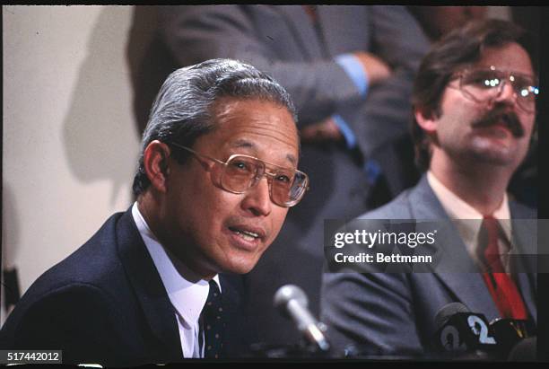 New York: Close up of Kenji Tamiya, the president of the Sony Corporation seated and speaking at a press conference.