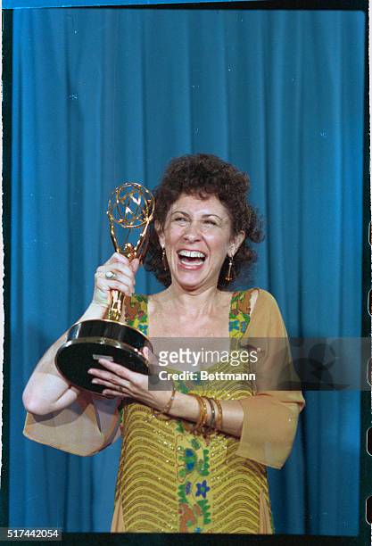 Pasadena, California: Rhea Perlman of Cheers exults with her Emmy Award, September 23rd, that she won for Outstanding Supporting Actress in a Comedy...