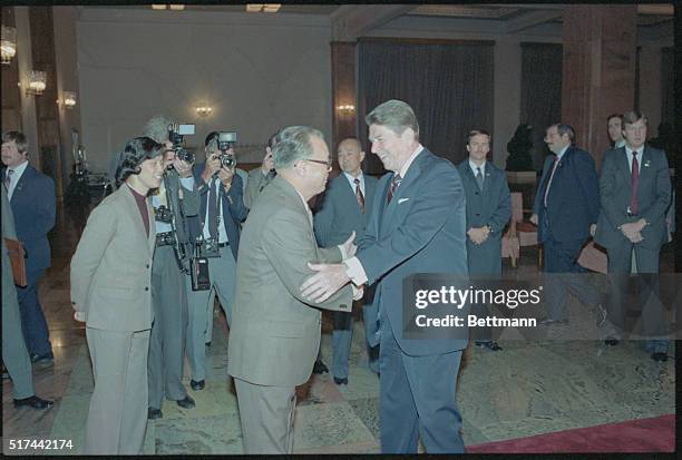 Peking, China: Chinese Premier Zhao Ziyang, left, greets President Ronald Reagan, in the foyer of the Great Hall of the People prior to entering the...
