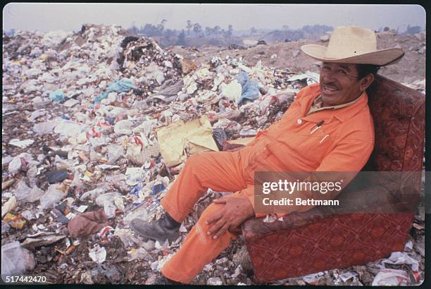 Mexico City, Mexico: A member of the Sindicato de los Pepenedores, or Scavengers Union, sits on a discarded chair at the Santa Catarina Dump outside...