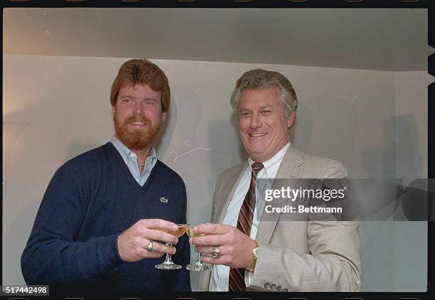 Chicago, Illinois: Chicago Cubs' right handed Rick Sutcliffe and general manager Dallas Green enjoy a toast at a news conference after Sutcliffe was...