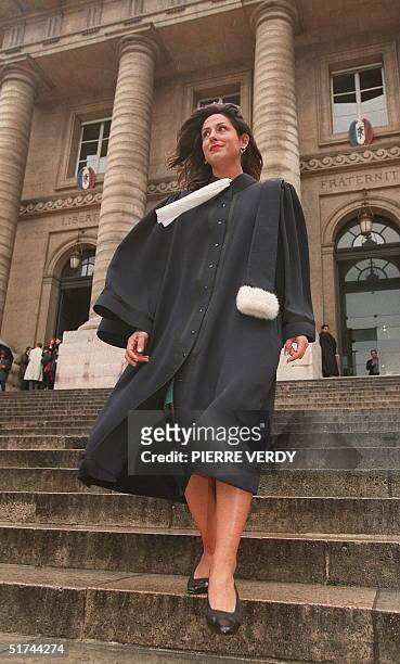 Sappho Garelli a Parisian lawyer, models a robe designed by French stylist Pierre Cardin on the stairs of Paris courthouse, 03 July. The robe is made...