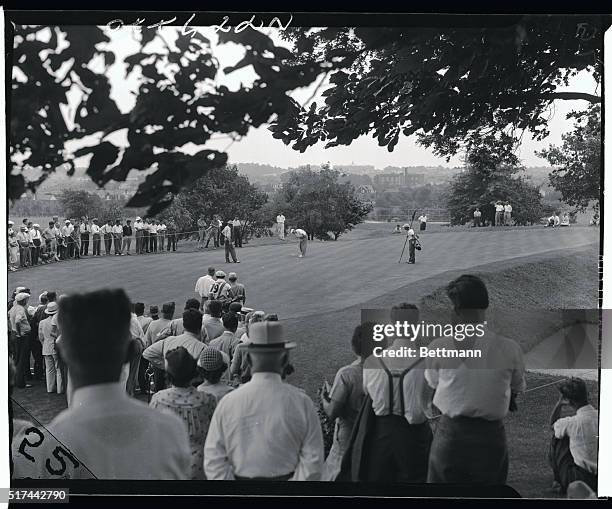 Byron Nelson, National Open champion, sinks a putt for a birdie three on the 18th hole of the Pomonok Country Club links as he eliminates "Dutch"...