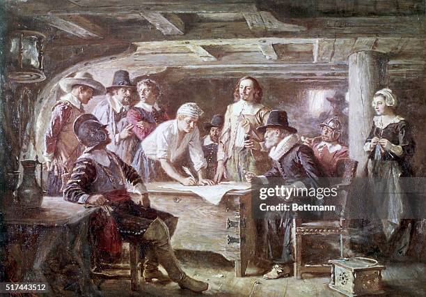 The signing of the Mayflower Compact by passengers on board the Mayflower in November 1620. The sitters include John Carver, John Alden, Myles...