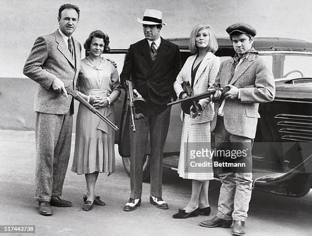 The cast of the 1967 film Bonnie and Clyde posing with guns. From left to right: actor Gene Hackman as Buck Barrow, actress Estelle Parsons as...