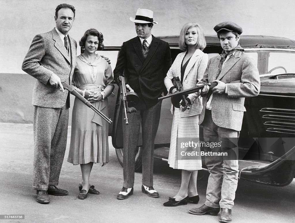 The cast of the 1967 film Bonnie and Clyde posing with guns. From