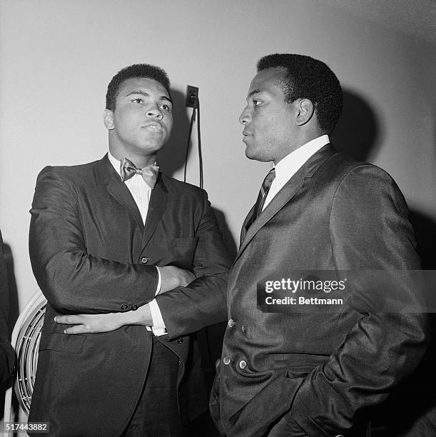 Chicago, Illinois- Cassius Clay, , shown with his friend Jimmy Brown of the Cleveland Browns as Clay arrived for a meeting with the Illinois Athletic...