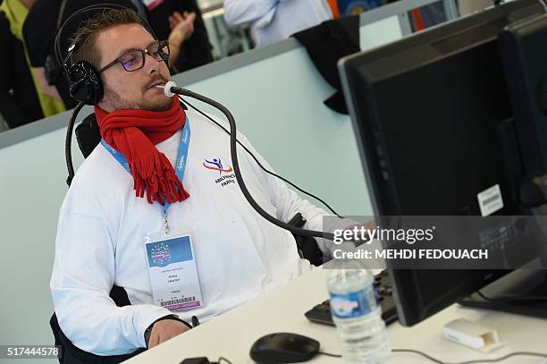 Webmaster works with a human-computer interface controlled by the lips during the 9th International Abylympics, a skill competition featuring persons...