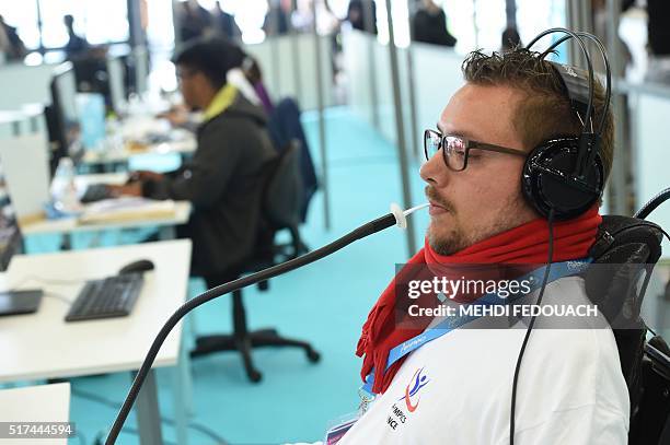 Webmaster works with a human-computer interface controlled by the lips during the 9th International Abylympics, a skill competition featuring persons...