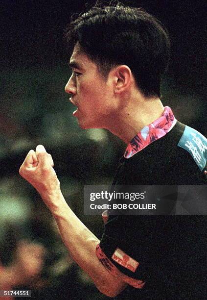 China's Kong Linghui clenches his fist after winning a point during his game against France's Jean-Phillippe Gatien 30 April in the opening match of...