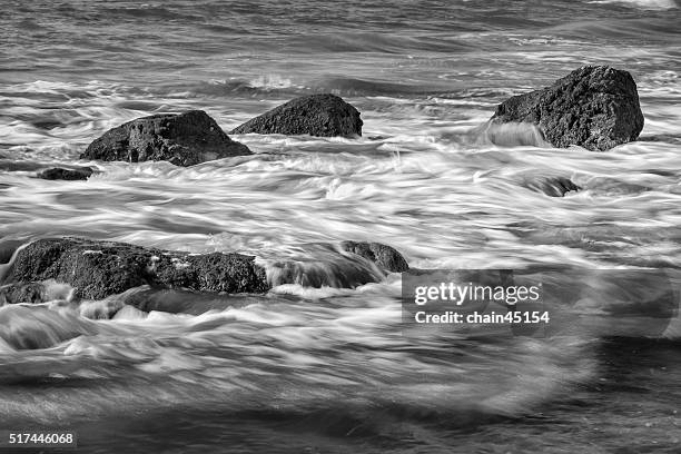sea waves rolling on stones in puket, thailand beach - puket fotografías e imágenes de stock