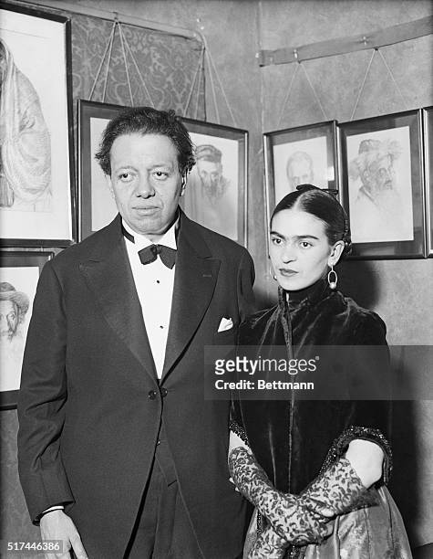 Artists Diego Rivera and Frida Kahlo visit an art gallery exhibition of Jewish portraits by Lionel Reiss in New York.