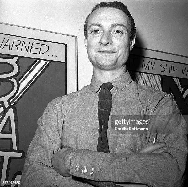 New York, NY - Close-up of artist Roy Lichtenstein with his arms folded standing in front of one of his famous comic-book inspired art works at the...