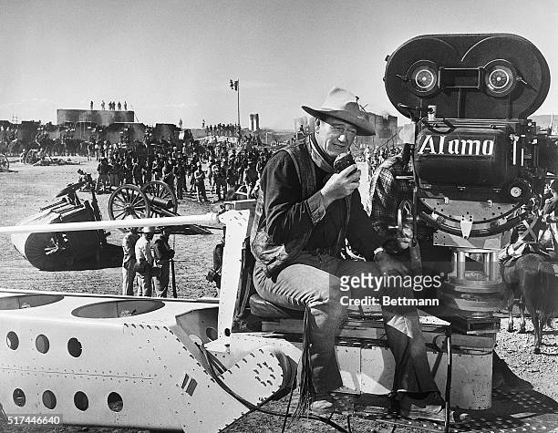 John Wayne is shown as he directs during the filming of "The Alamo."
