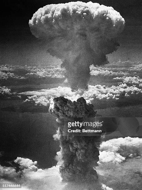 Mushroom cloud towers 20,000 feet above Nagasaki, Japan, following a second nuclear attack by the United States on August 9, 1945. The bombing -...