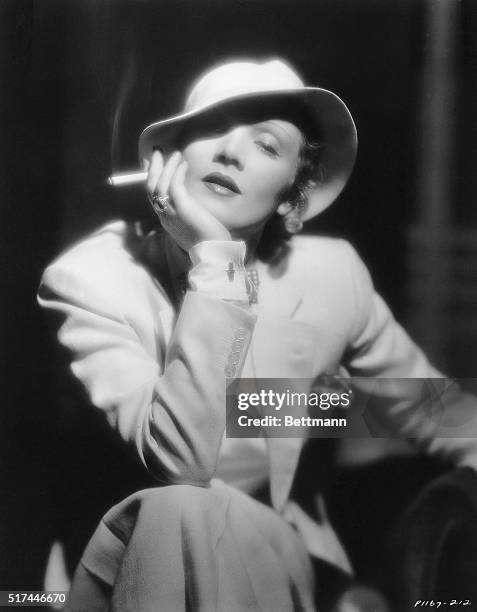 Publicity portrait of Marlene Dietrich , Berlin-born actress famous for films such as "Morocco" and "Blond Venus" . She is shown here holding a...