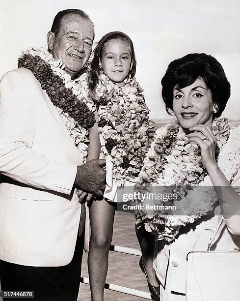 Honolulu,HI- : Actor John Wayne, his wife and daughter, Aissa, , arrived in Honolulu July 9th aboard the SS Matsonia. Wayne is in Hawaii for the...