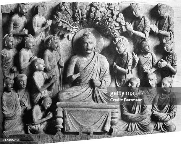 Buddha, seated under the Bodhi tree worshipped by monks, princes, and bodhisattvas. Photograph of sculpture in the Indian Museum of Sarnath. 2nd...