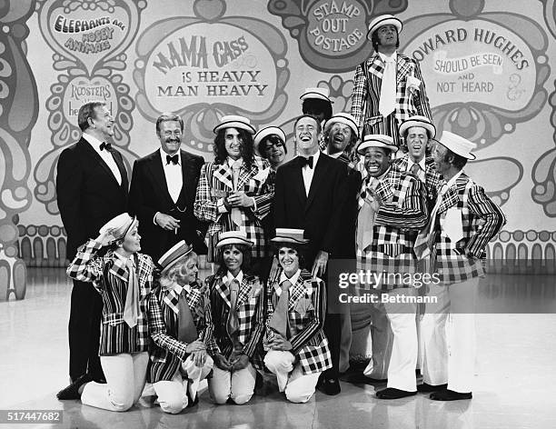 Left to right , John Wayne, Dan Rowan, Tiny Tim, Jo Anne Worley, Dick Martin, Alan Sues, Johnny Brown, Dennis Allen, Larry Hovis; , Teresa Graves,...