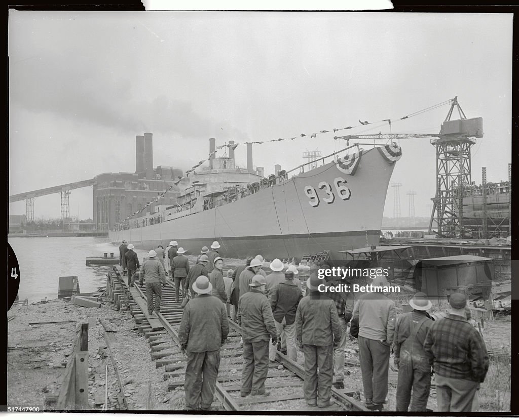 The Decatur Sloop Shipyard workers watch as the new destroyer Decatur slides down the ...
