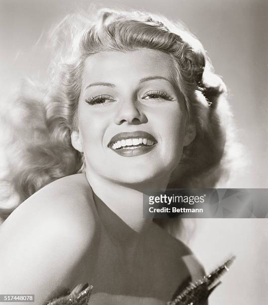 Loveliest Russet-Top of Them All: Columbia's Rita Hayworth, who stars in the technicolor Down to Earth, with Larry Parks playing opposite. The film...