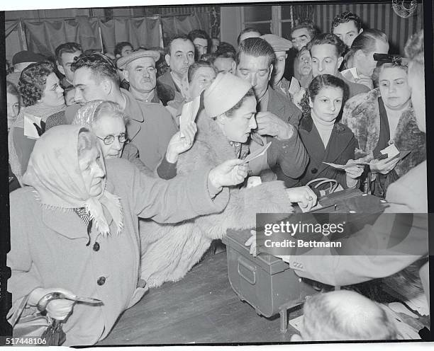 Halfway through French National Assembly Election Day, January 2nd, crowds like these continued to swamp the polling places. Both the Communists and...