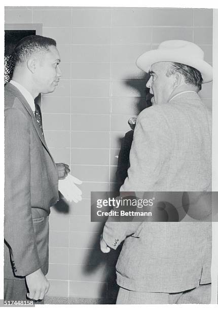 Negro attorney M.W. Plummer exchanges words with oilman J.M. Wren in Houston, April 11th, when the oilman allegedly attempted to prevent the attorney...