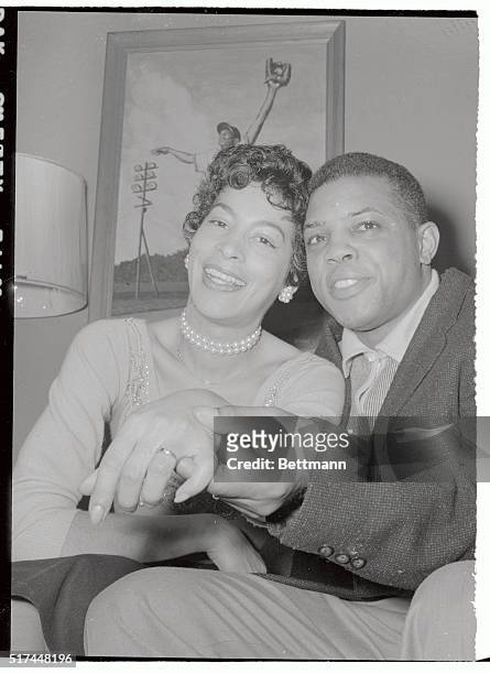 New York Giants star outfielder Willie Mays is shown with his bride of a few hours, Marguerite, at her home in Elmhurst, New York, after their...