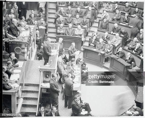 In a scene that's become quite familiar since the end of World War II, members of the French National Assembly listen to Socialist Party leader Guy...