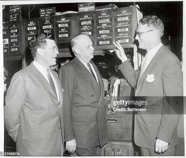 Keith Funston , president of the New York Stock Exchange, points out the Kerr-McGee stock listing on the board of the N.Y. Stock Exchange as Dean A....