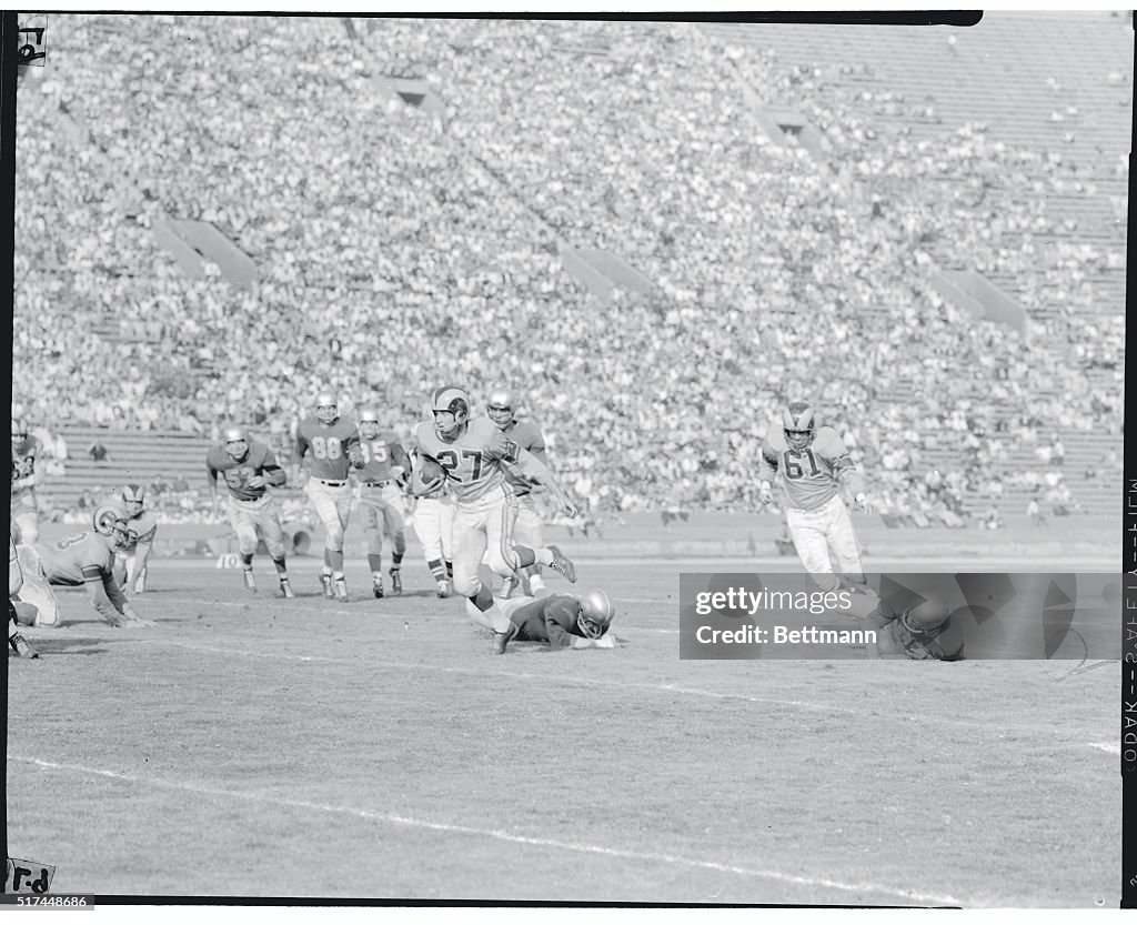 Ron Waller Running With a Football