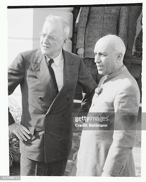 India's Prime Minister Jawaharlal Nehru greets U.S. Secretary of State John Foster Dulles, after Dulles arrived in New Delhi.