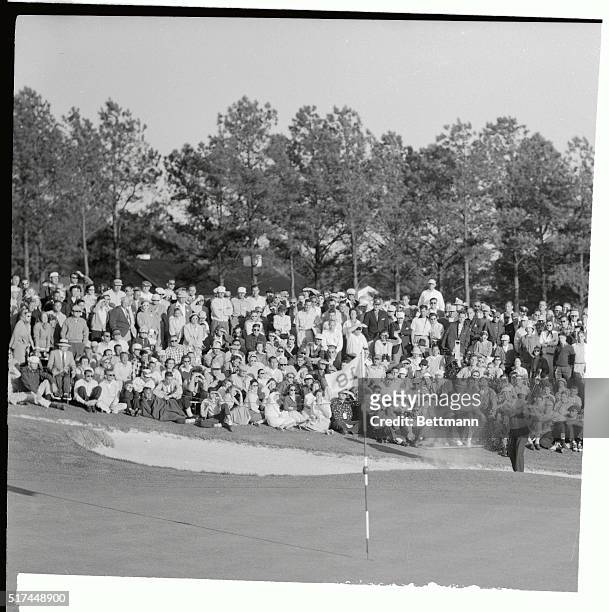 Ken Venturi, amateur, who almost became the first amateur to win the Masters Golf Tournament, is shown blasting from a trap on the eighteenth hole....