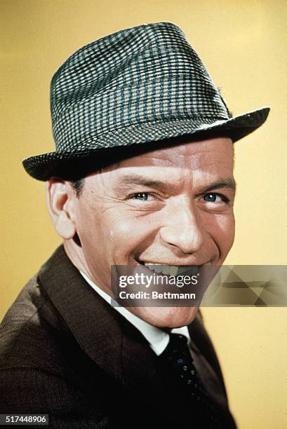 The popular American singer Frank Sinatra is shown here in this closeup photo smiling. His nicknames include "Ol' Blue Eyes" and "Chairman of the...