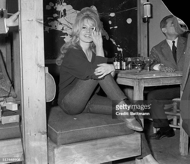 Clad in jeans and sweater, Brigitte Bardot receives newsmen on amovie set in Paris late May 31. She was working in the last scenes of her latest film...