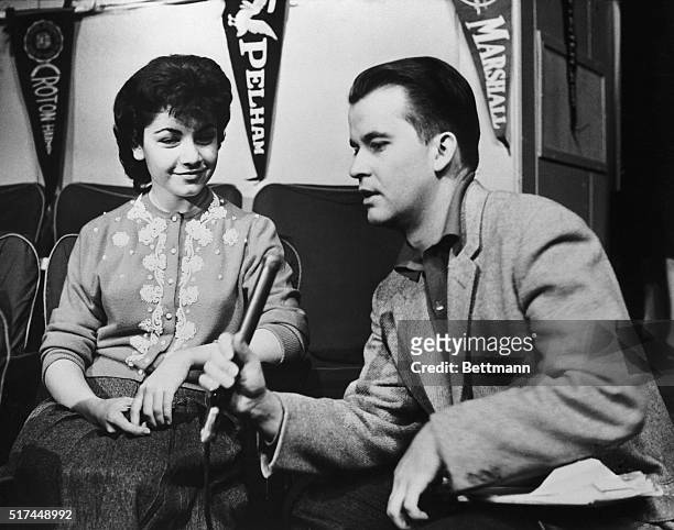 Dick Clark and Annette Funicello, whose newest record O Dio Mio is one of the nation's top sellers, go over the script for The Dick Clark Show on...