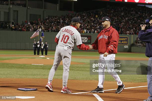 Manager Terry Francona of the Boston Red Sox congratulates Manager Tony Larussa of the St. Louis Cardinals before game one of the 2004 World Series...