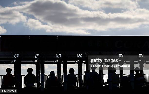 Jockeys wait in the stalls to begin the race during the All Weather Championships Finals Day at Lingfield Park on March 25, 2016 in Lingfield,...