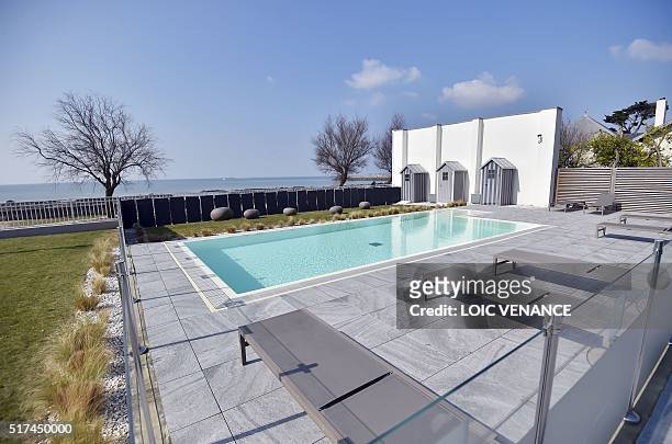 Picture taken on March 23, 2016 in Pornichet, western France, shows a swimming pool of the hotel and spa of Chateau des Tourelles, which will host...