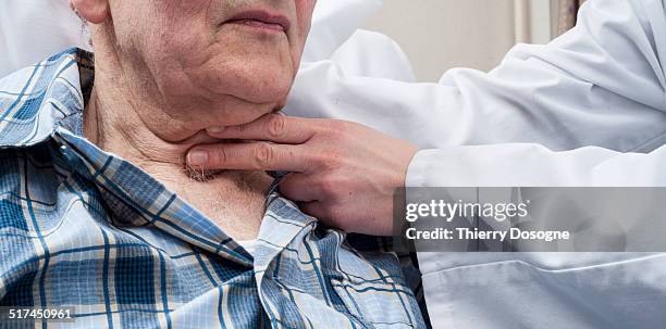 speech therapist checking man's throat - speech therapy imagens e fotografias de stock