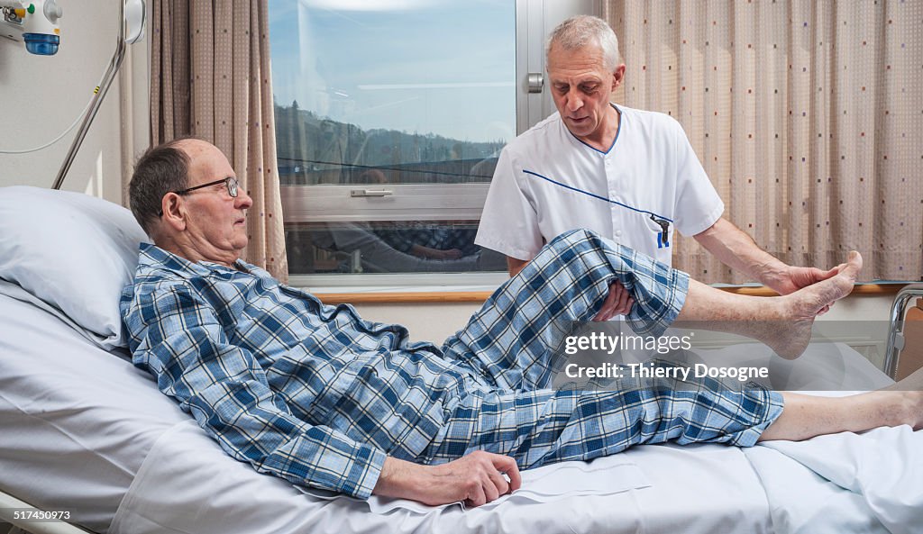 Physical therapist working with patient