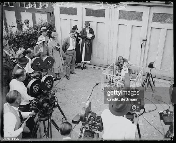 New York: Hauptmann's wife and baby pose for newsreel cameramen.