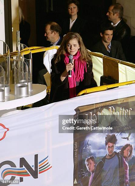 Actress Emma Watson flicks the switch to light up this year's Oxford Street Christmas Lights on November 15, 2004 in London. She was accompanied by...