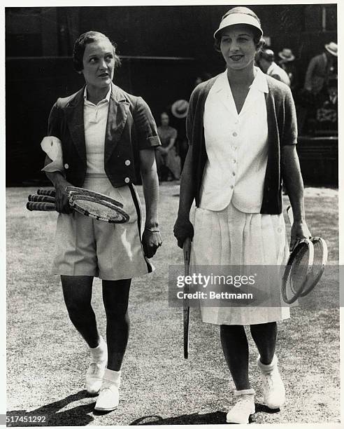 The two Helens from California, Helen Jacobs at left, and Mrs. Helen Wills Moody, walk onto Wimbledon's famed center court for the start of their...