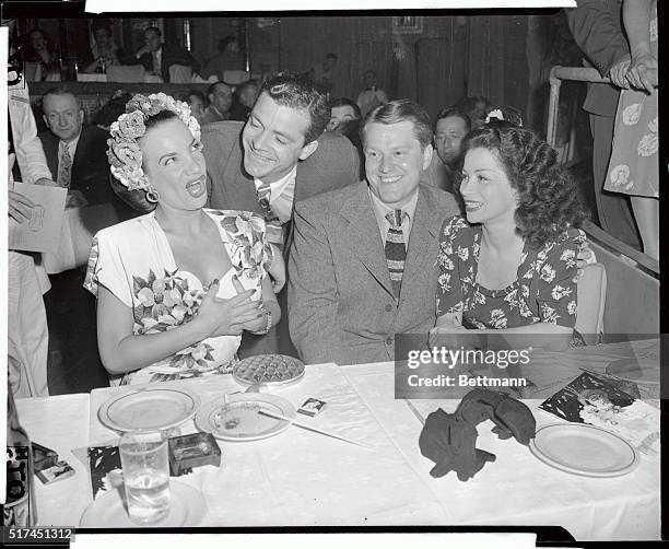 It's a real, gala Broadway welcome, here passed out to screen stars Michael O'Shea and Dana Andrews as they visit the Latin Quarter. The glamorous...